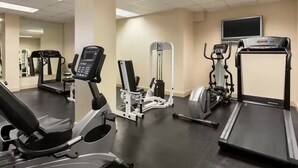 A gym with treadmills, elliptical machines, and weight equipment. - Sarasota “Executive Waterfront Suite” A  hotel rm # 103 on Sara Bay Marina (Sarasota)
