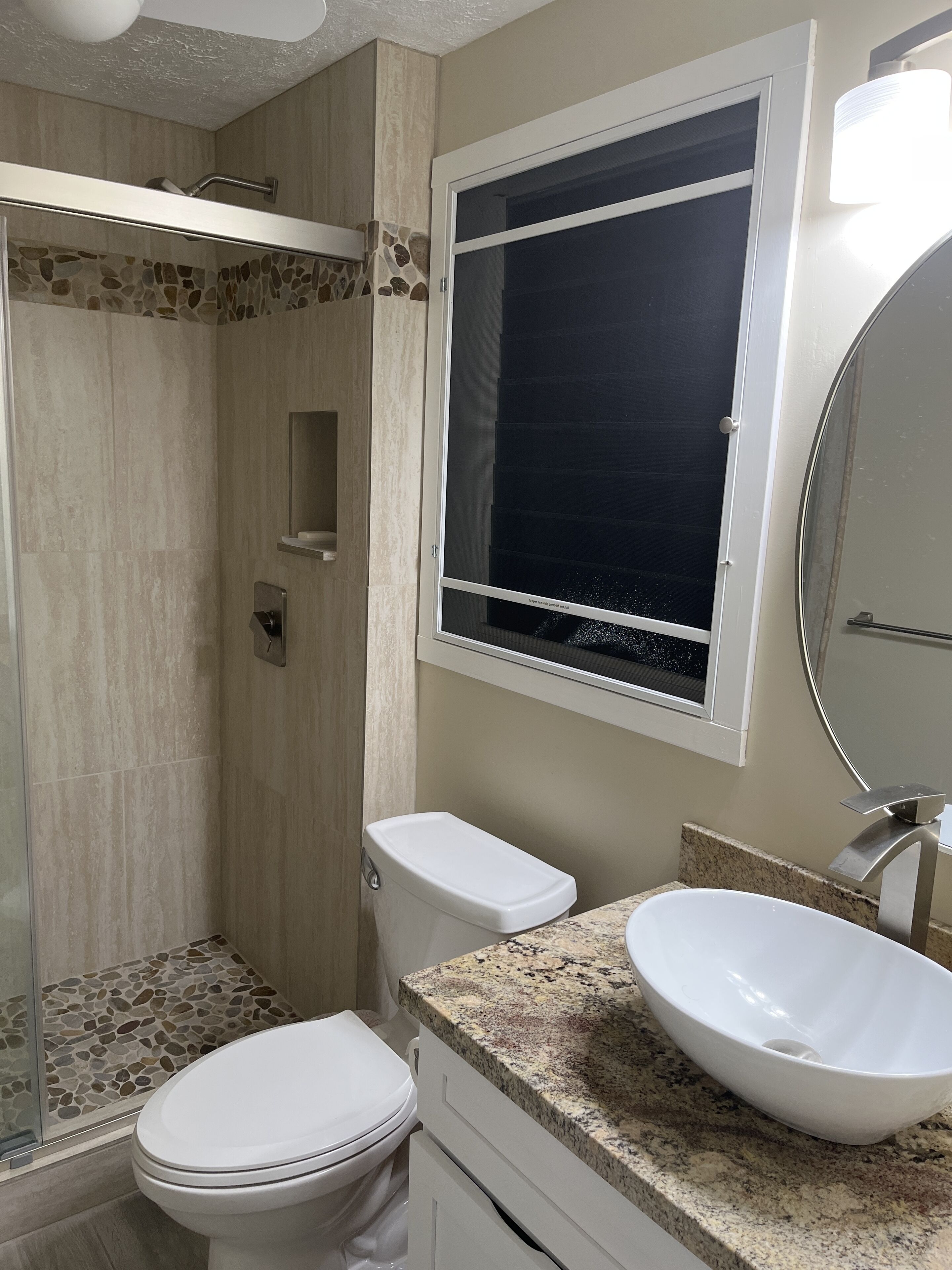 Combined shower/tub, hair dryer, towels, toilet paper