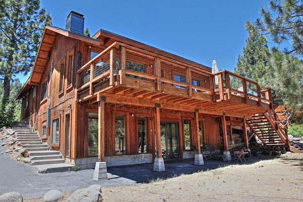 Rear of house with spectacular sweeping river & mountain view from both levels