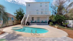 A two-story house with a covered patio and a swimming pool. - All Decked Out w/ private pool, Free Golf, Zipline (Destin)