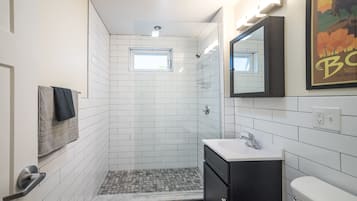 Shower, hair dryer, towels, shampoo