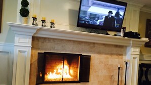 A fireplace with a TV mounted above it. - VACATION HOME HAVE POOL & SPA / NEAR TO BEACHES-DISNEYLAND. (Huntington Beach)