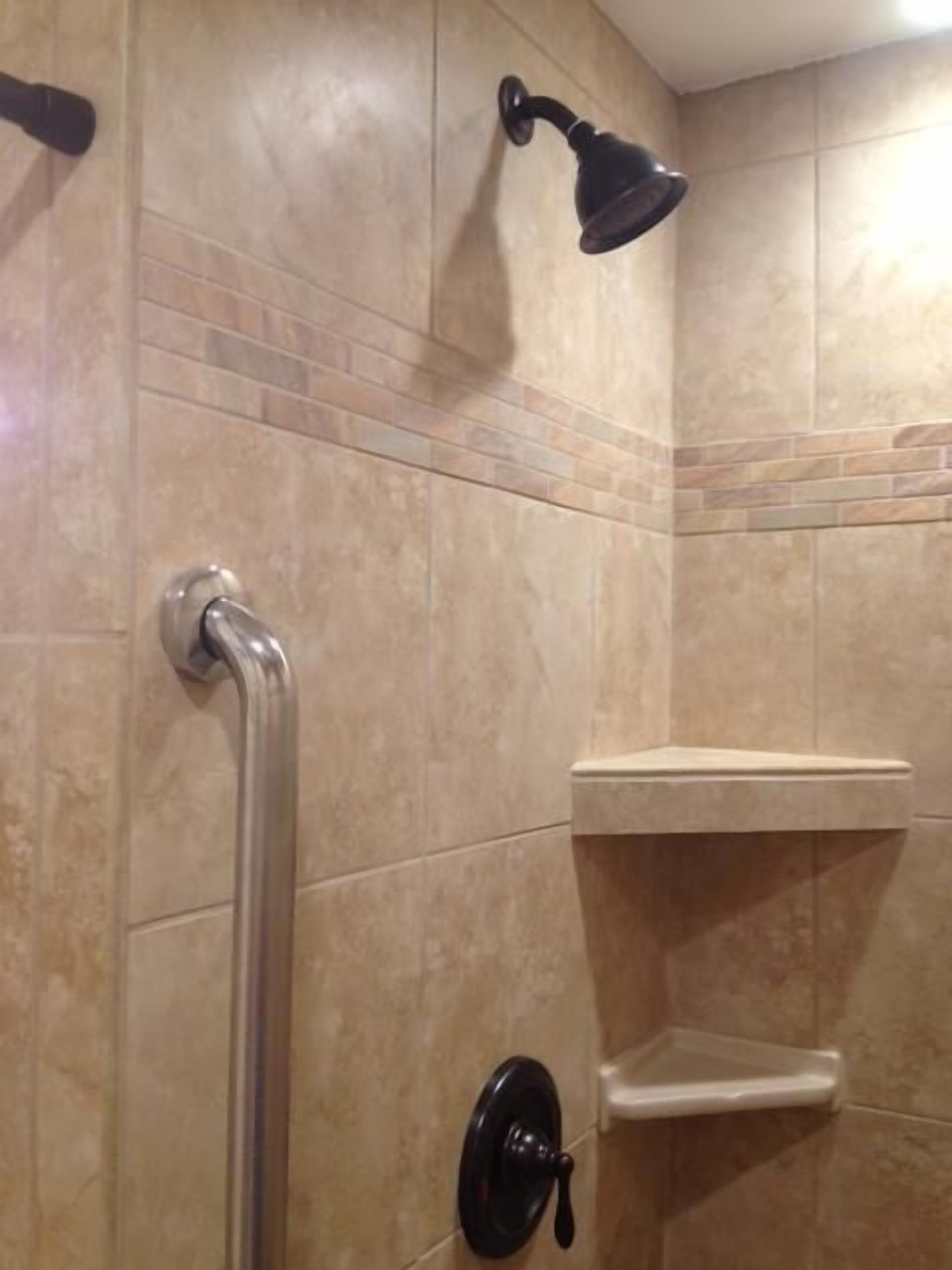 Combined shower/tub, hair dryer, towels, toilet paper
