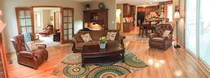 Relax in this inviting space with comfortable leather armchairs and a large coffee table.