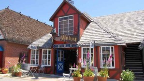 A red building with a sign reading "Vinhus" and a thatched roof. - 3 bedroom 2.5 bath 2,200 SF within Solvang Danish Village (Solvang)