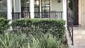 A house with a porch, a mailbox, and a door with the number 151. - Stunning five bedroom home with private pool, just steps from the beach! (Panama City Beach)