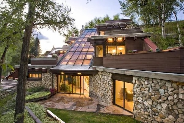 View of house showing sloping glass roof that creates views from all 4 levels