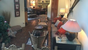 Un salon chaleureux avec une cheminée, des sièges confortables et un coin repas.