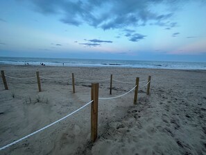 On the beach, sun loungers - North OC Oceanfront Condo. Big deck. Entire 1st floor. fully remodeled in 2025. (Ocean City)