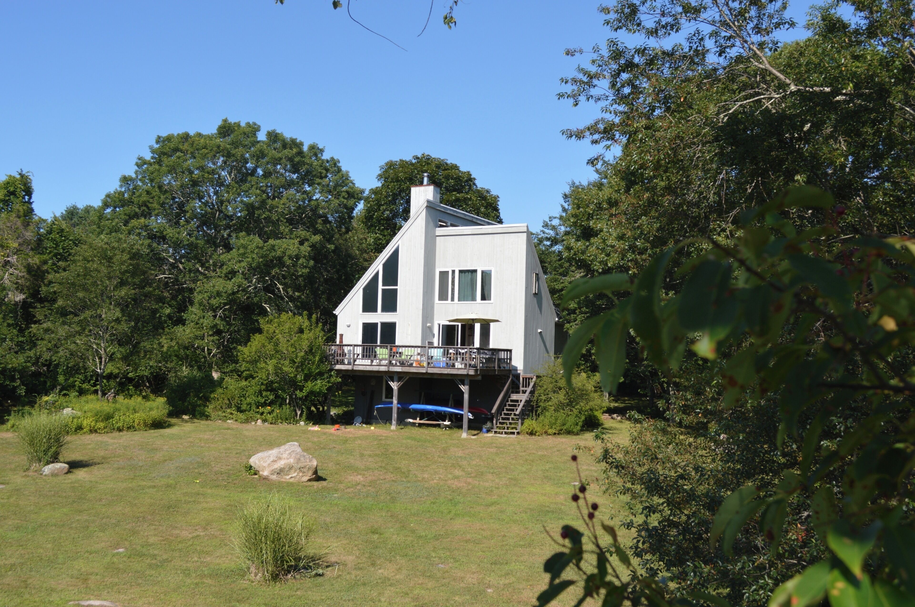 This side of the house faces Stonington Harbor, over a large yard w/ sea view