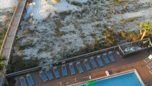 A pool area with sun loungers and a small pool.