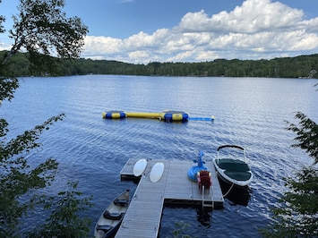Large dock with two water trampolines, log, and Lilly pad