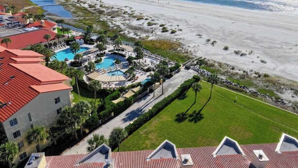 A resort with multiple swimming pools, a beach, and a view of the ocean. - Oceanfront King & Prince Villa | Breathtaking Ocean Views | Access to Resort Amenities! (St. Simons Island)