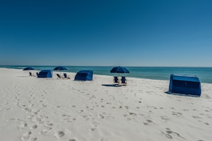 On the beach, sun loungers, beach towels