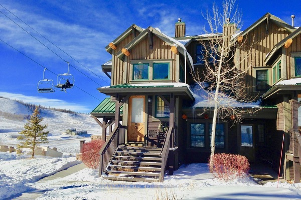 The front door is just right of the tree - 50 feet from slope to condo!