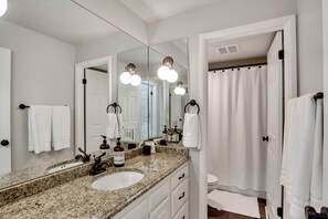 Combined shower/bathtub, hair dryer, towels, soap