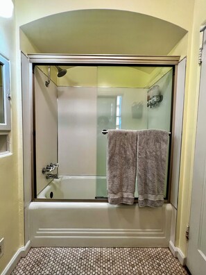 Combined shower/tub, hair dryer, towels, soap