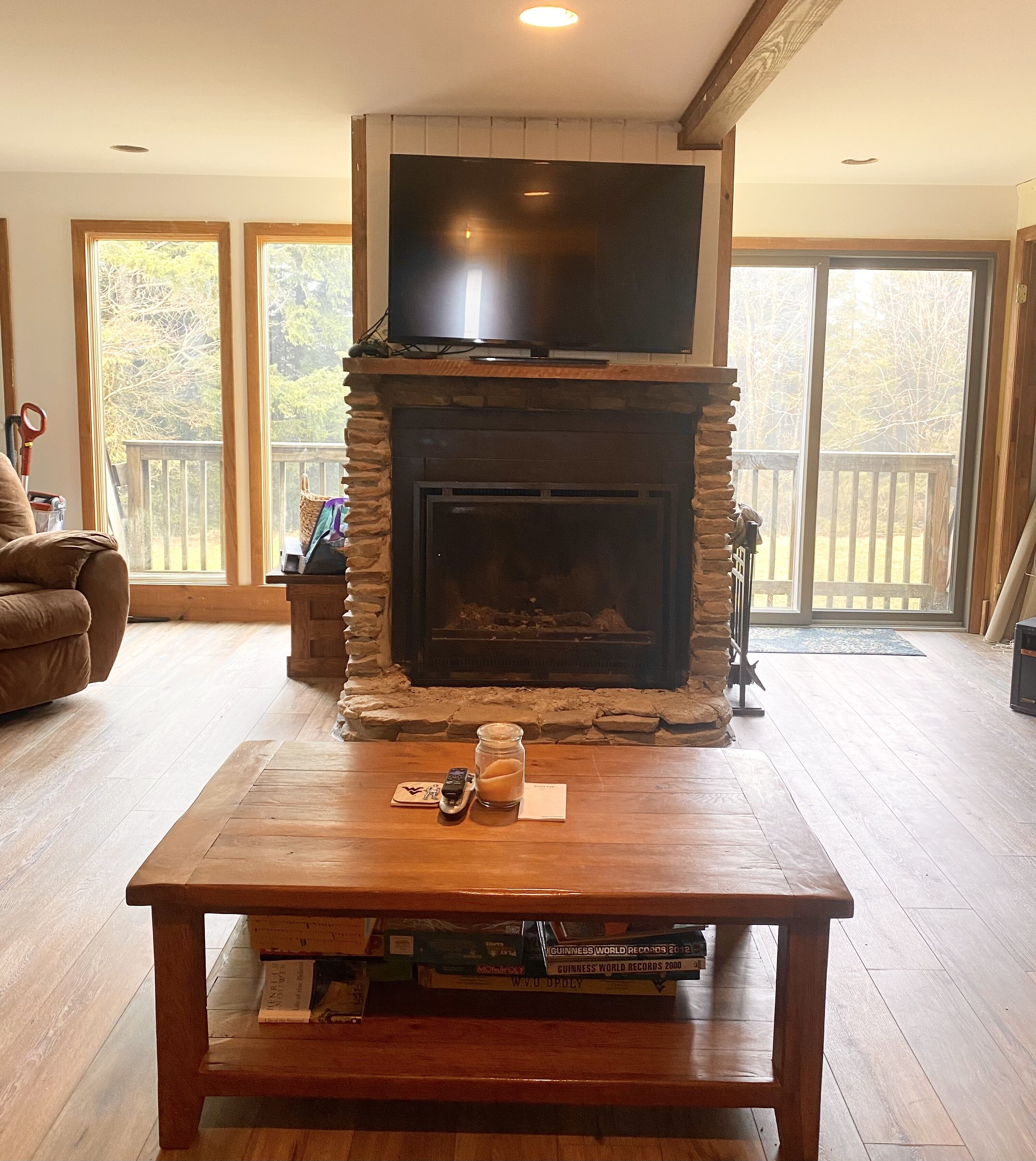 Wood Burning Fireplace  and Large Screen TV with view to back yard  wildlife