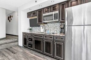 Fridge, microwave, stovetop, coffee/tea maker