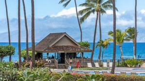 A beachside lounge with a view of the ocean, surrounded by palm trees and a small building labeled "FAMILY ROOM". - ❤️ Stunning Reno| Amazing Ocean View 💦❤️ (Lahaina-Kaanapali)