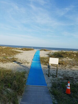 Beach mat to ocean from condo