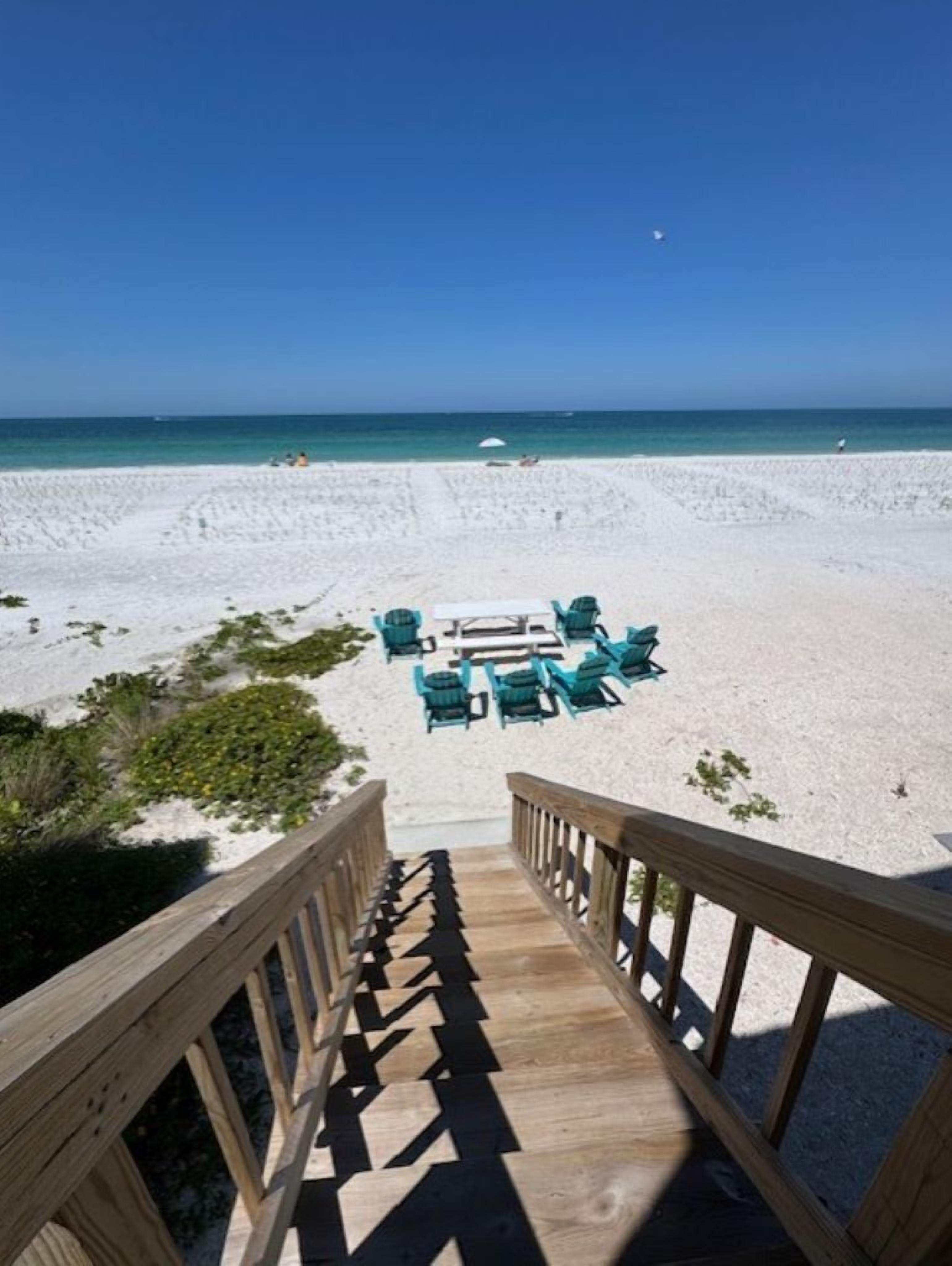 On the beach, sun loungers, beach towels