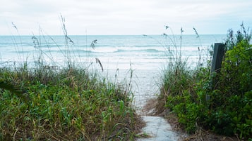 On the beach, sun loungers, beach towels