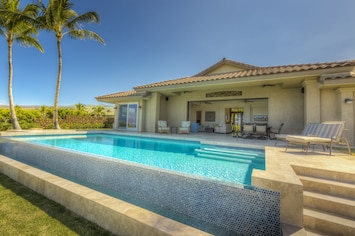 Open concept inside and out. Salt water infinity pool.