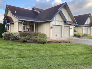 Beautiful end unit condo with 2 car garage.