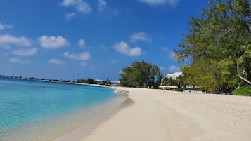 On the beach, sun loungers, beach towels