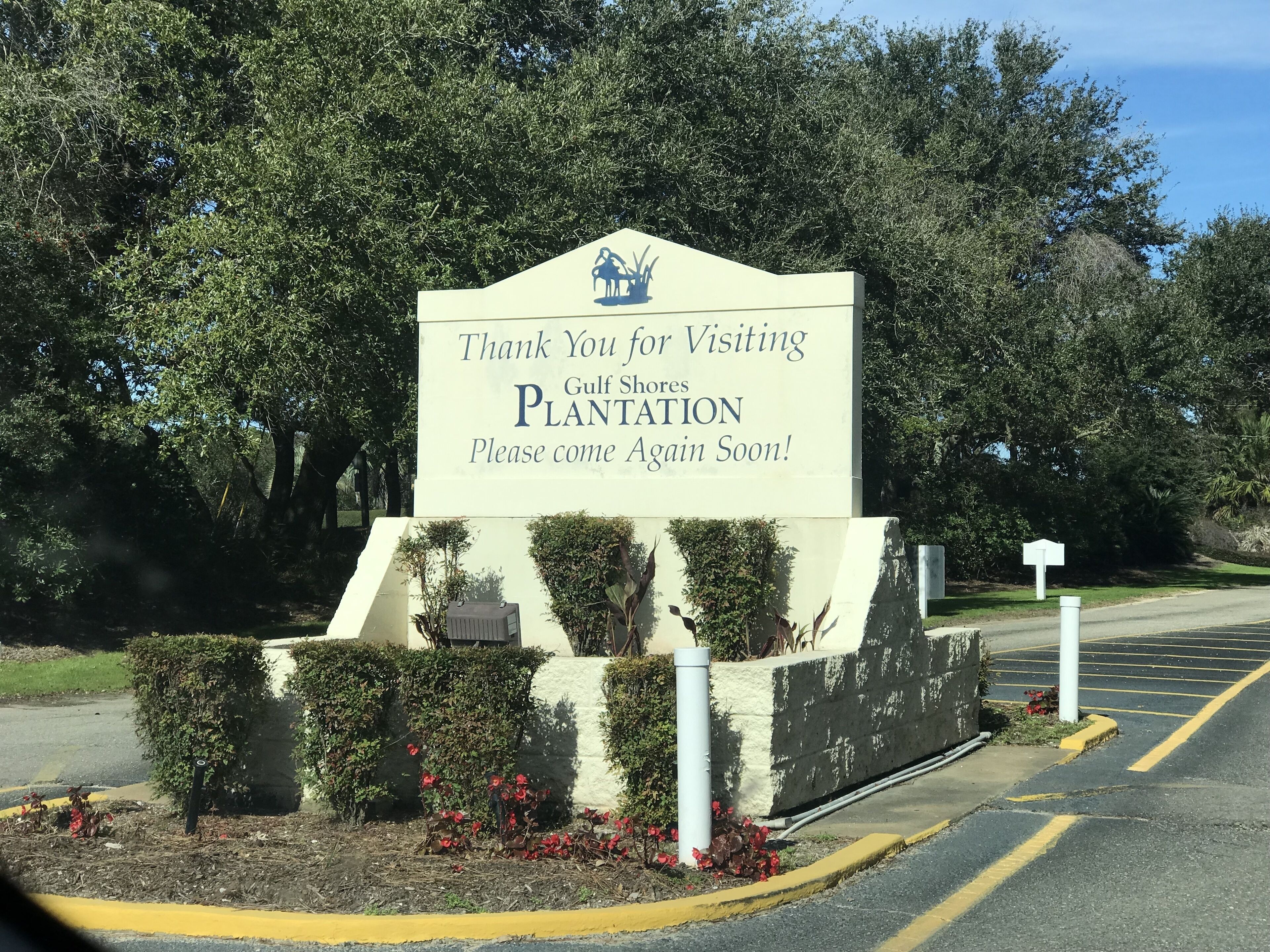 A sign for Gulf Shores Plantation with a thank you message and a request to return soon.