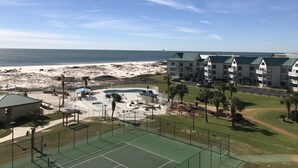 A beachfront hotel with multiple-story buildings, a swimming pool, and a tennis court. - 🏖 Beach front 3 bedroom 2 bath and 3 balconies corner unit extra balconies (Gulf Shores)