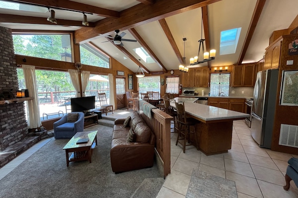 Flat-screen TV, fireplace, DVD player, books