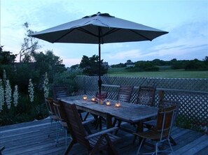 Enjoy a romantic dinner under the stars on this serene outdoor deck with a table for six.