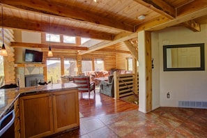 Kitchen View over Peninsula to Living Room; Pantry door off hall (in mirror)