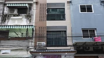 A multi-story building with a storefront at the ground level.