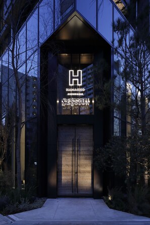 A modern building with a prominent 'H' sign and the name 'SESSIONS' on the facade. - Hamacho Hotel Tokyo Nihonbashi (Tokyo)