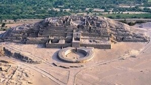 An ancient archaeological site with a large circular structure and terraced ruins. - Hostal Sandel (Barranca)