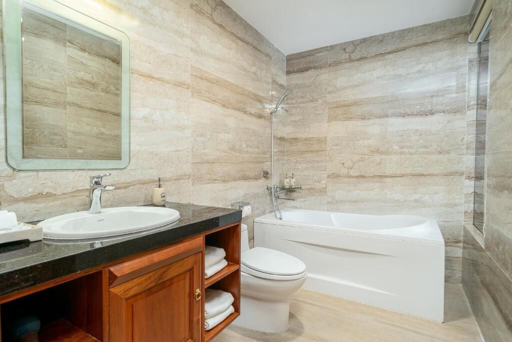 family connecting rooms with city view | bathroom | separate bathtub and shower, eco-friendly toiletries, hair dryer