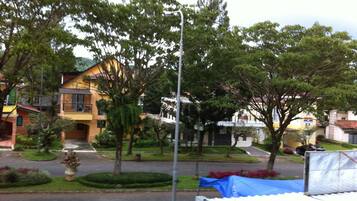 A residential area with houses, trees, and a street.