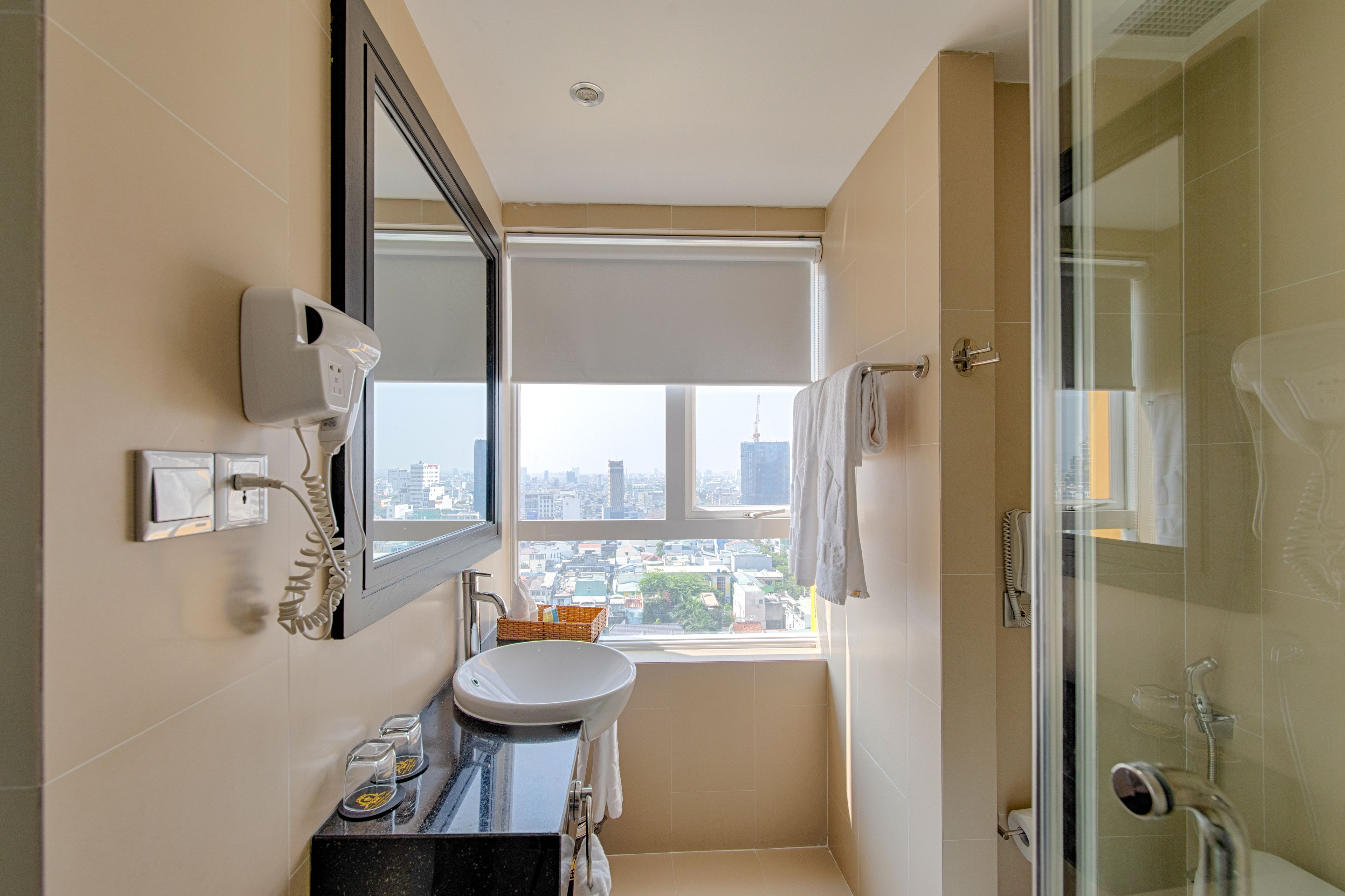 deluxe twin room, city view | bathroom | shower, free toiletries, hair dryer, bathrobes