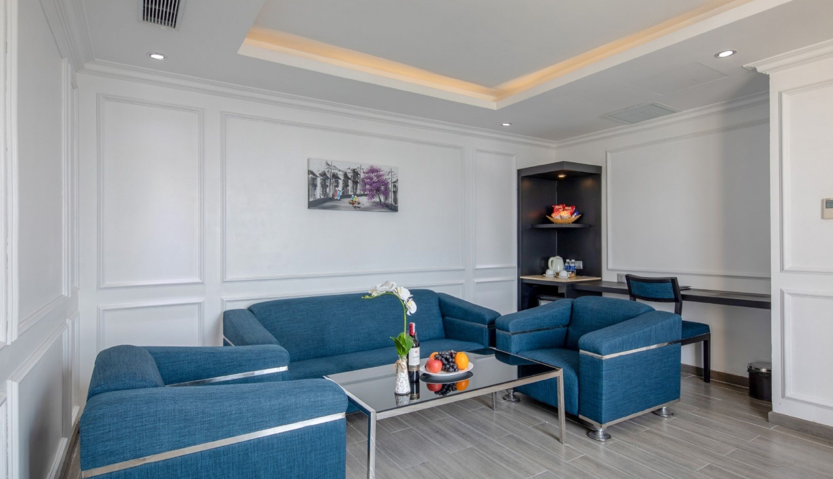 family triple room, city view | living area | lcd tv