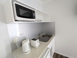 Standard Studio, 1 Queen Bed, Ground Floor (Budget Studio) | Private kitchen | Fridge, microwave, electric kettle, toaster