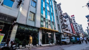 A multi-story hotel with a prominent sign reading "KRISHNA HOTEL". - OYO 25125 Paharganj Dx (New Delhi)