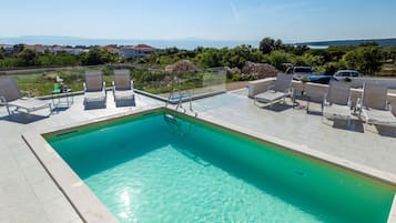 Outdoor pool, open 9:00 AM to 9:00 PM, sun loungers