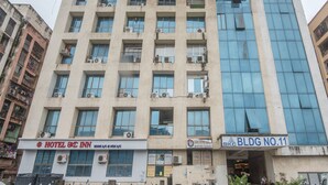 A multi-story building with a ground floor featuring a hotel named "HOTEL BKC INN" and a business center labeled "BKC BLDG NO.11". - OYO 22039 Hotel Bkc Grand (Mumbai)