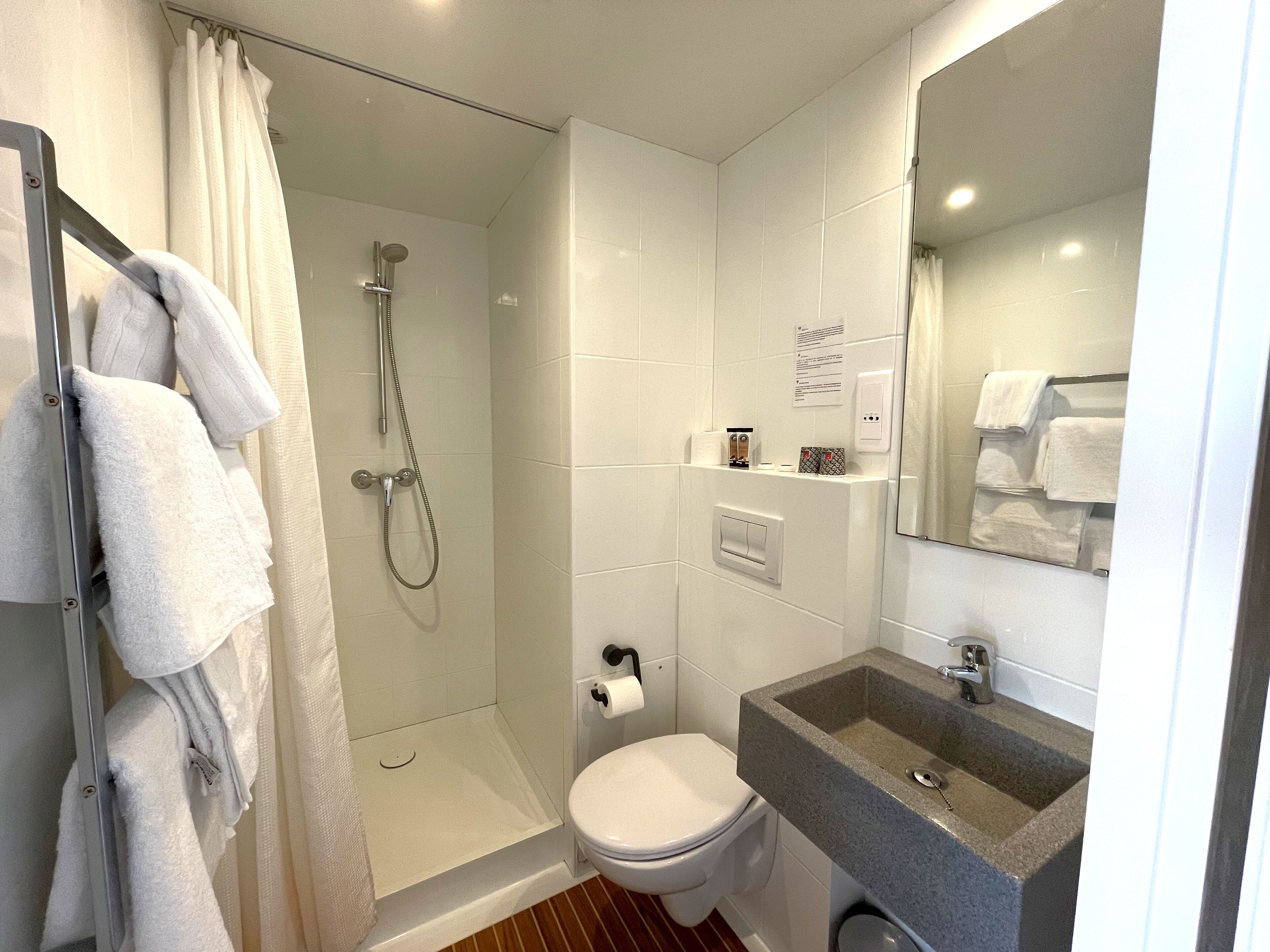 family room | bathroom | shower, rainfall showerhead, free toiletries, hair dryer