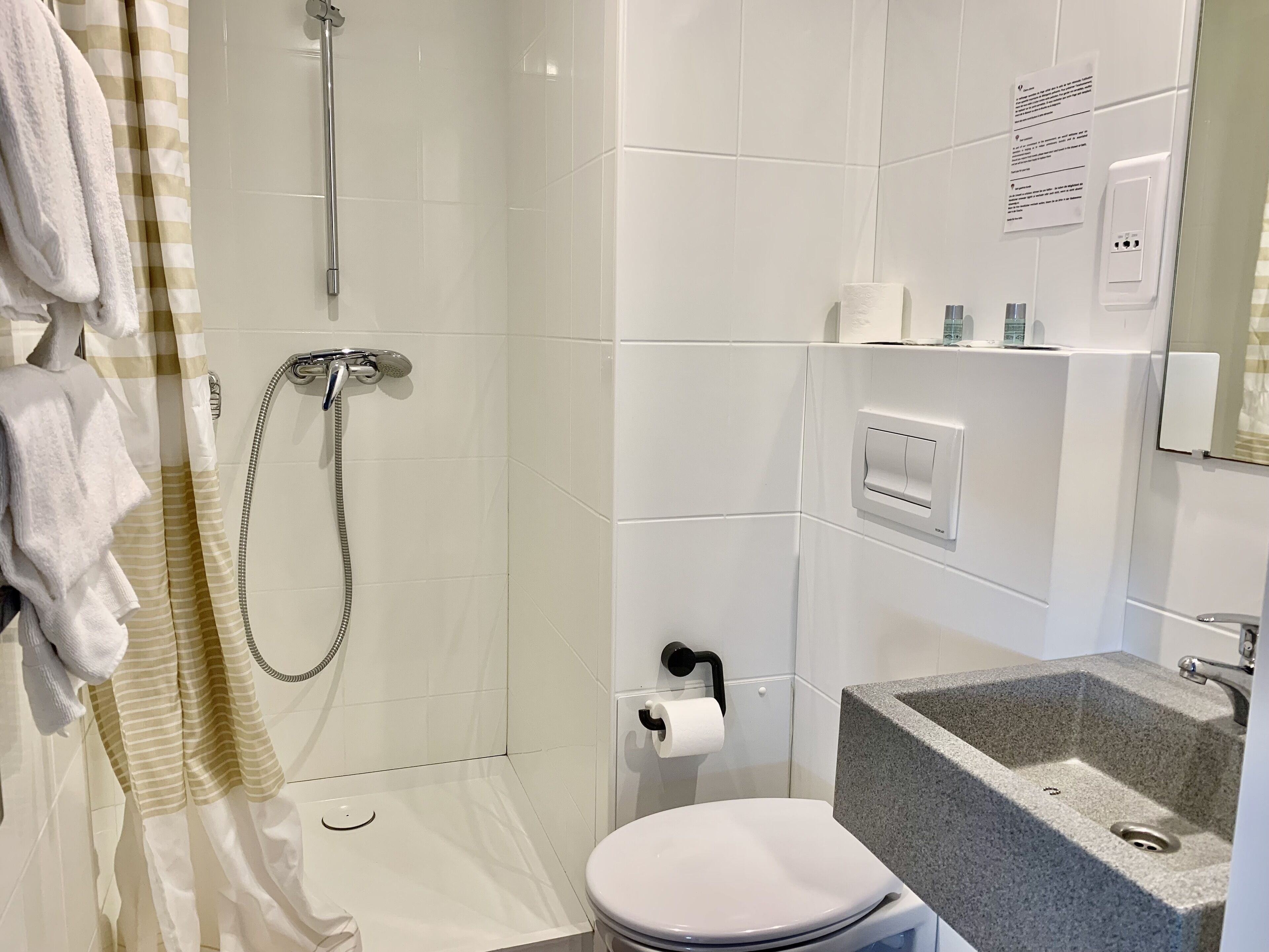 family room | bathroom | shower, rainfall showerhead, free toiletries, hair dryer