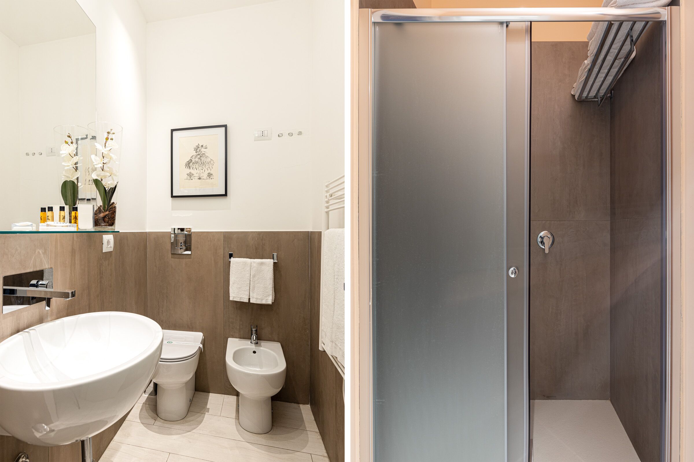 A modern bathroom with a large sink, toilet, bidet, and a walk-in shower.