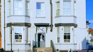 A two-story building with a cafe bar on the ground floor, featuring a traditional facade with multiple windows and a prominent entrance. - Marlborough Hotel (Hull)